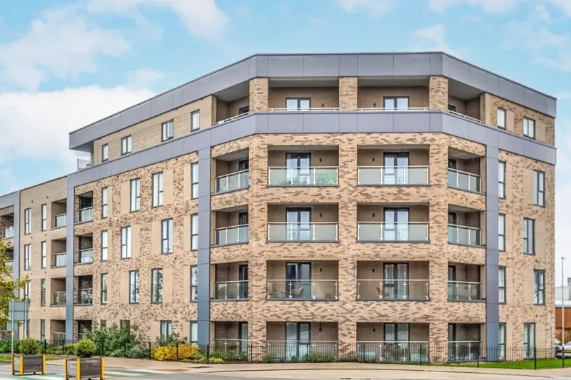 Modern low-rise residential apartment block with balconies