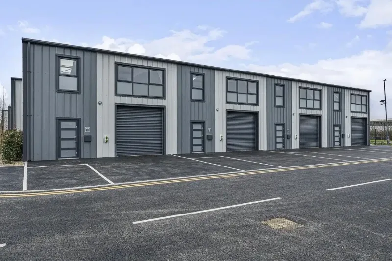 Row of light industrial commercial units with roller shutter doors